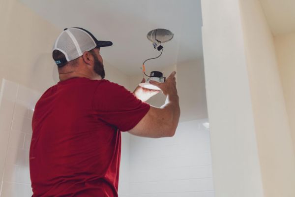Meeks electrician installs a light